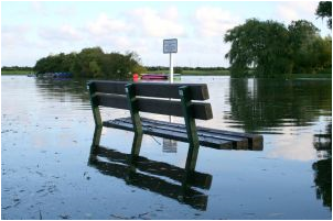 a flooded area with water upto the height of a bench